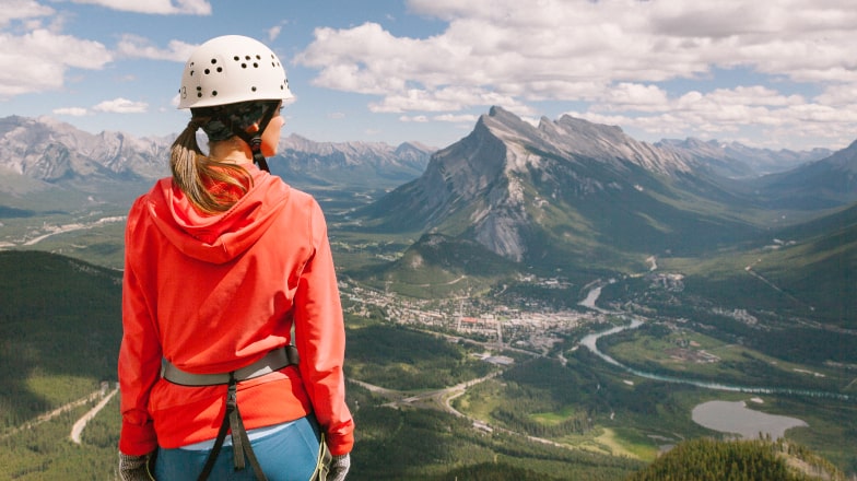 a person on the Via Ferrata at a viewpoint overlooking Banff