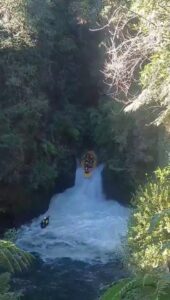 raft dropping a waterfall on the kaituna river in New Zealand