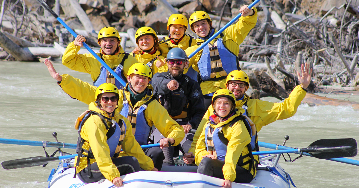 group of people in a raft on the river