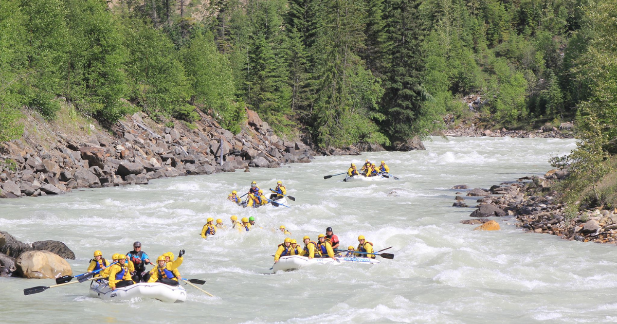 five boats enjoying kicking horse river rafting in Golden BC